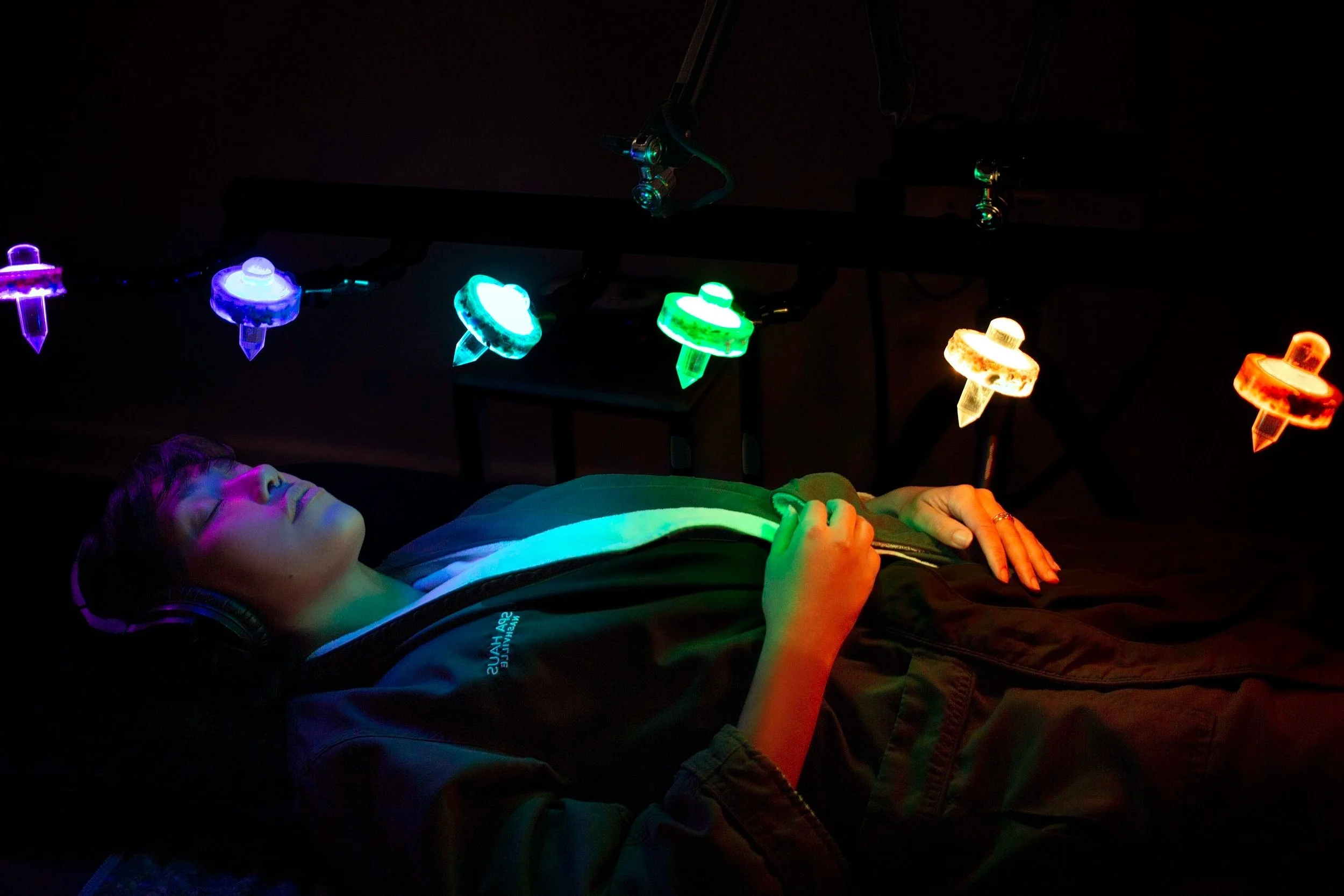 Crystal healing pod with illuminated interior